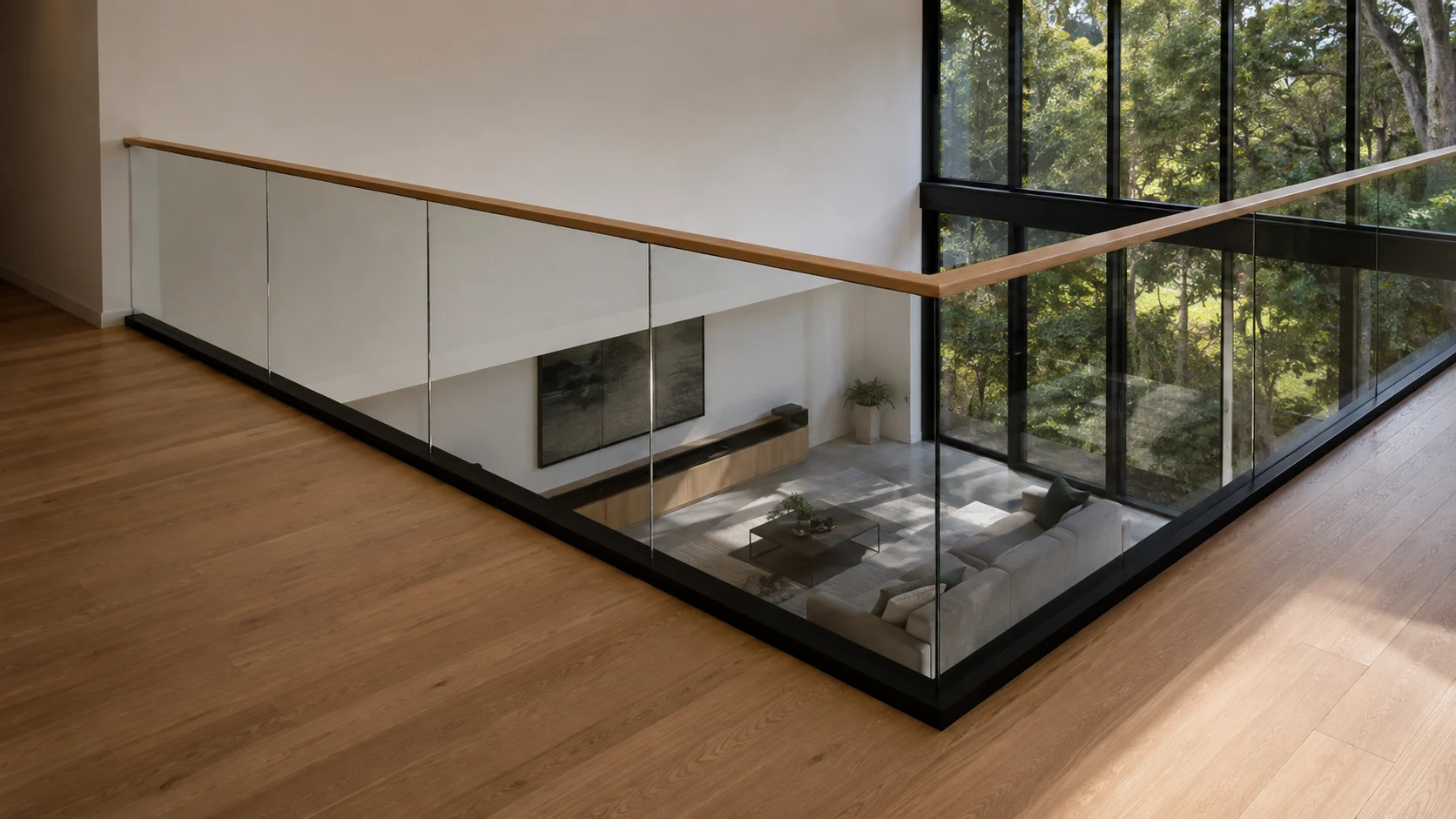 Clear glass balustrade protecting an upper-level interior void
