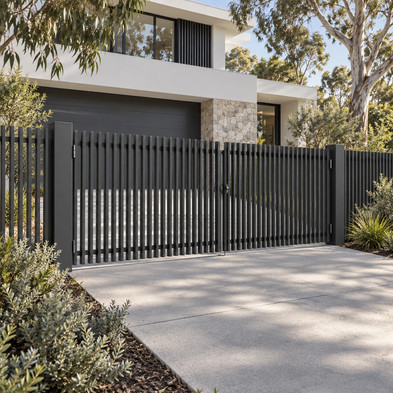 Monument blade double driveway gate with matching front fence
