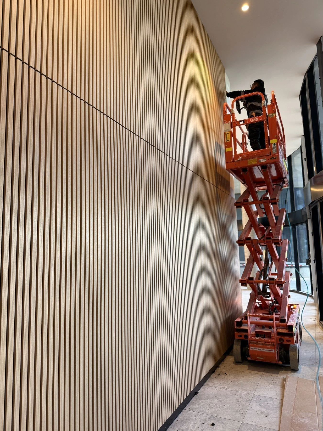 Heriton Acoustic Panel installed as a full-height slatted wall finish