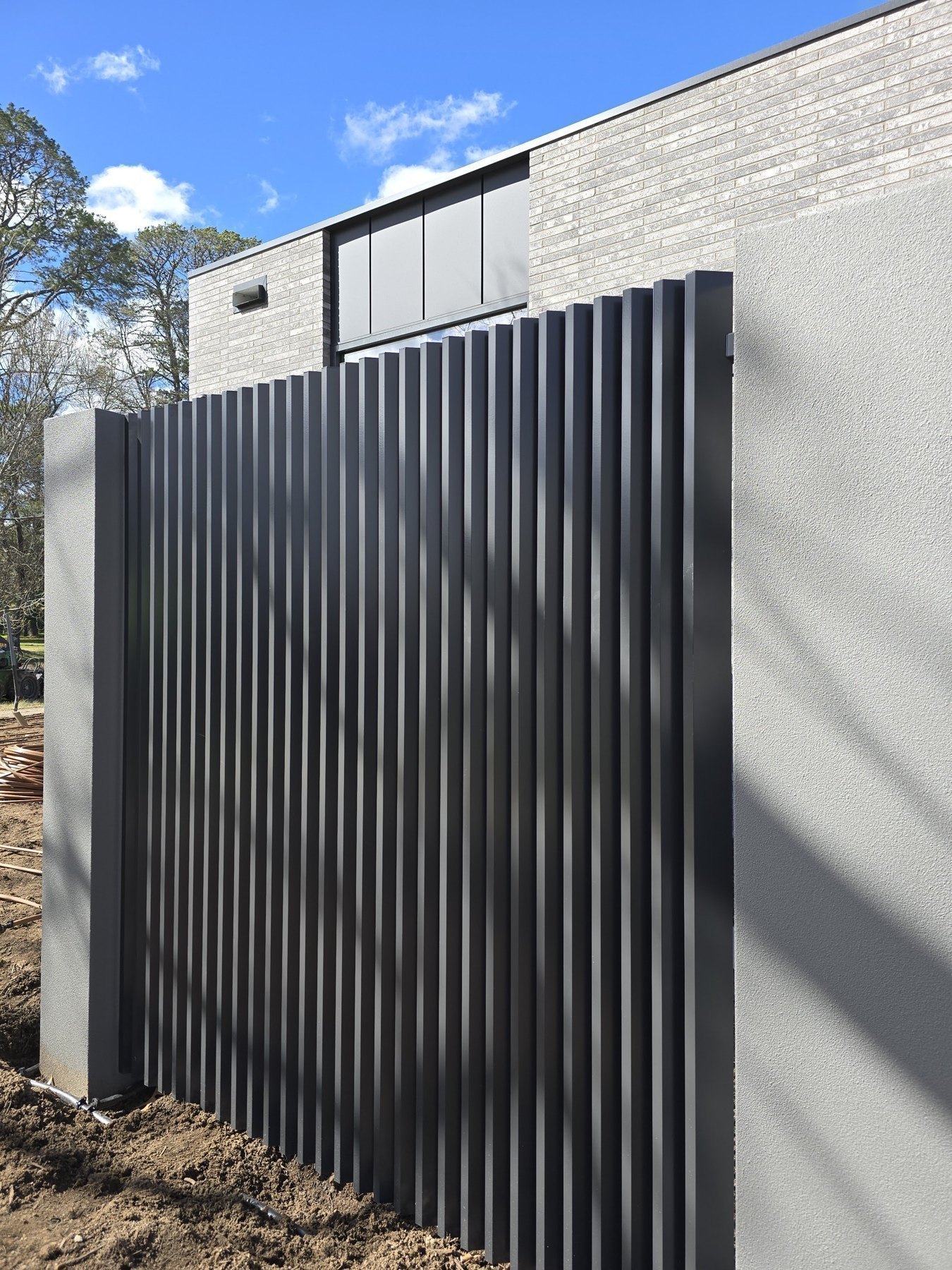 Louvre privacy screen beside a residential outdoor area